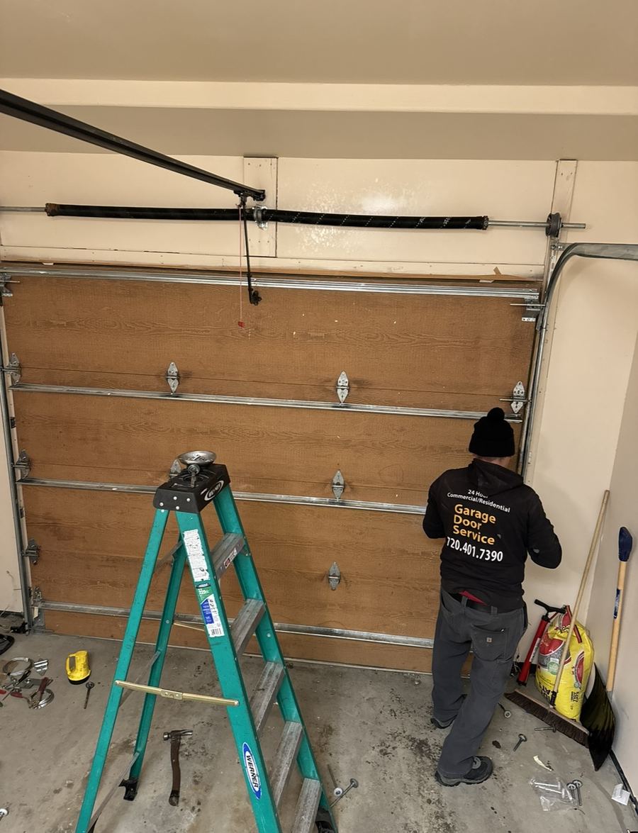 SoCal Garage Door Pros technician servicing a wood garage door
